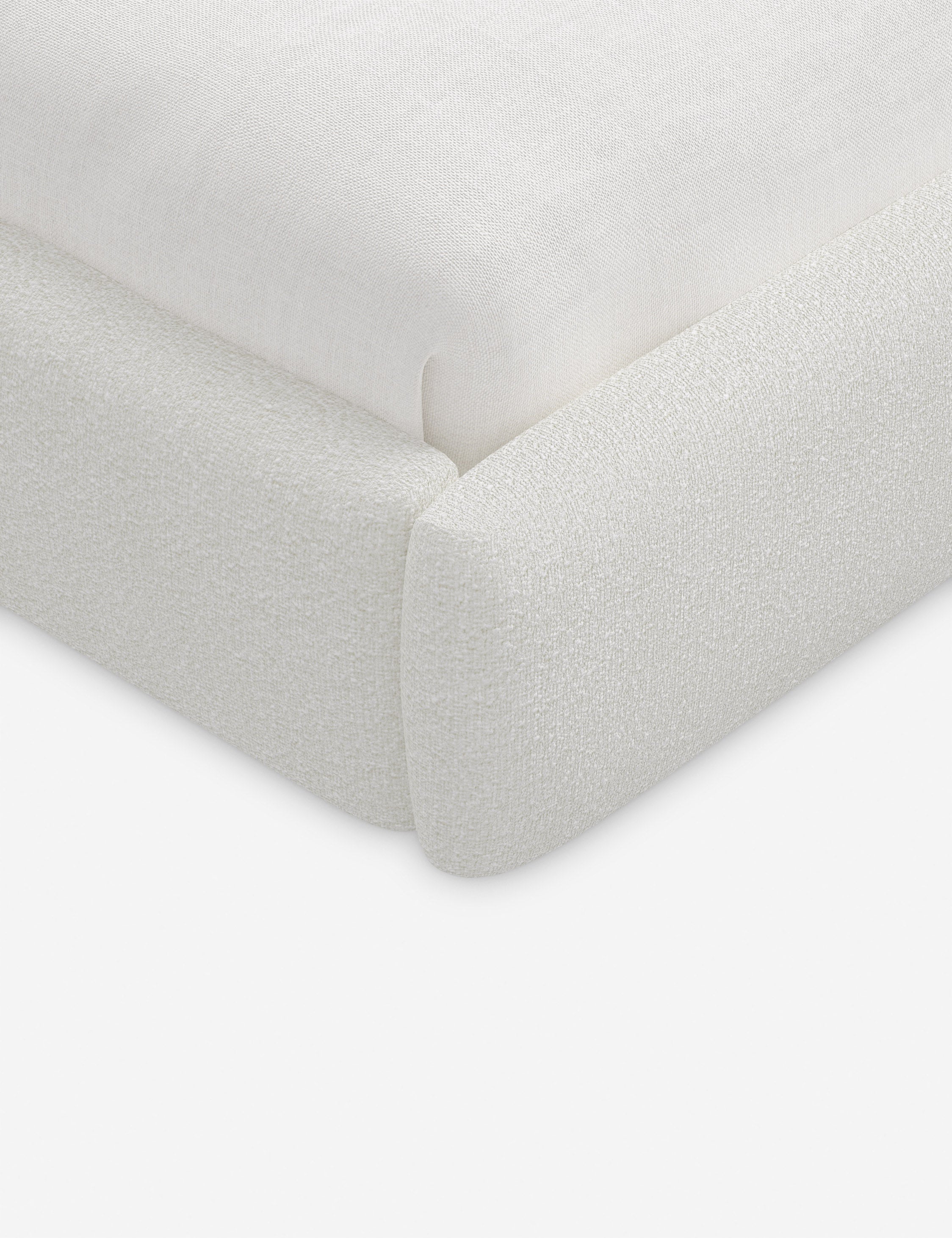 Lit plateforme haut - Un design épuré et une tête de lit arrondie confèrent une touche de douceur à ce cadre de lit tapissé