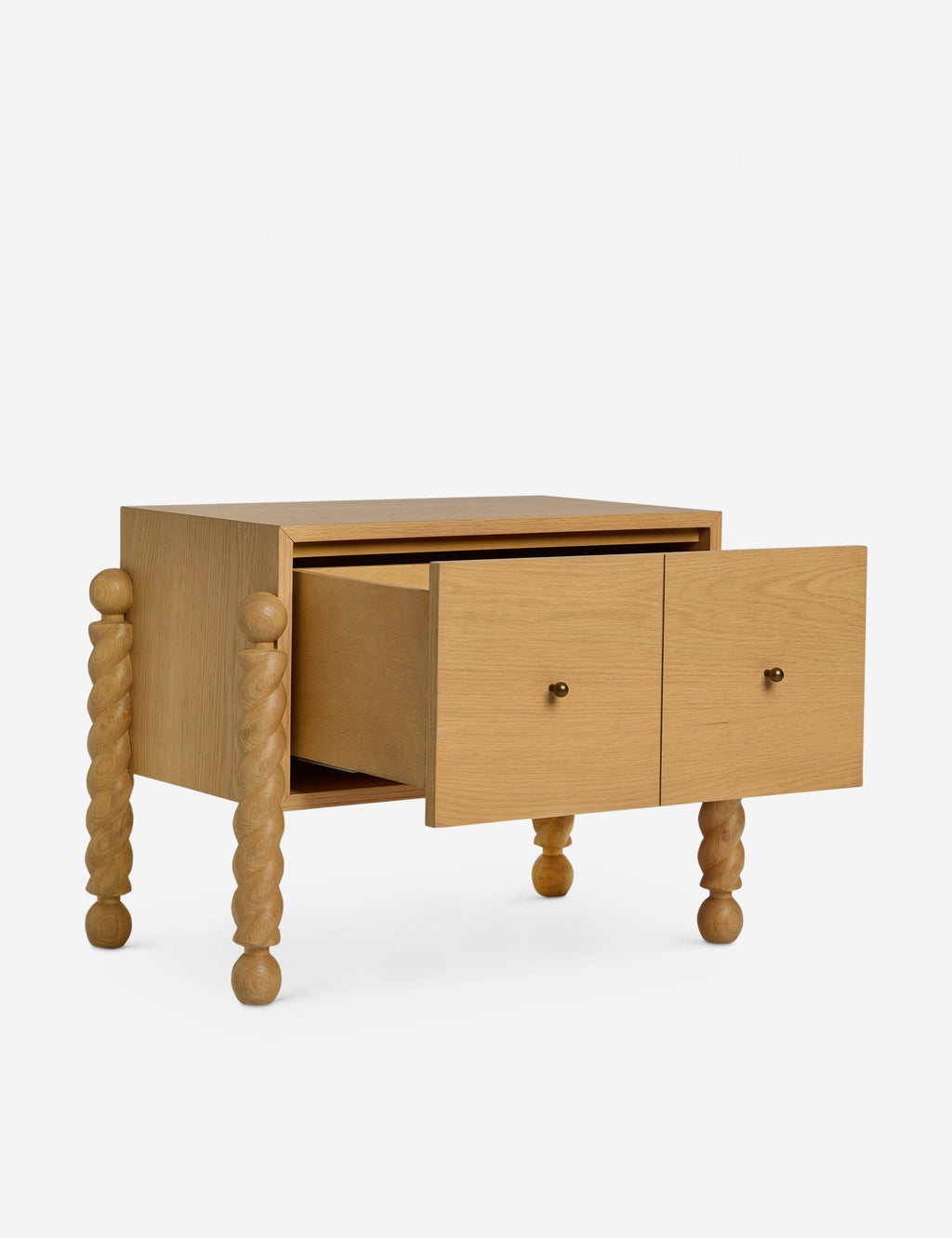 Table de chevet - Alliant avec raffinement formes et lignes, la table de chevet présente des pieds tournés sculpturaux qui encadrent une structure aux lignes épurées