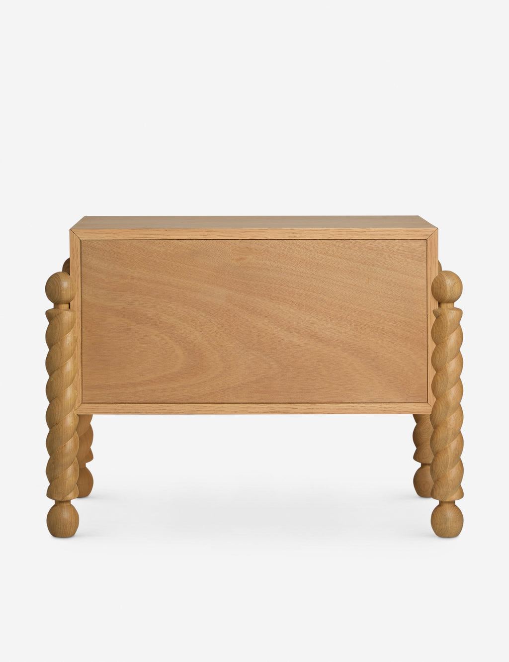 Table de chevet - Alliant avec raffinement formes et lignes, la table de chevet présente des pieds tournés sculpturaux qui encadrent une structure aux lignes épurées