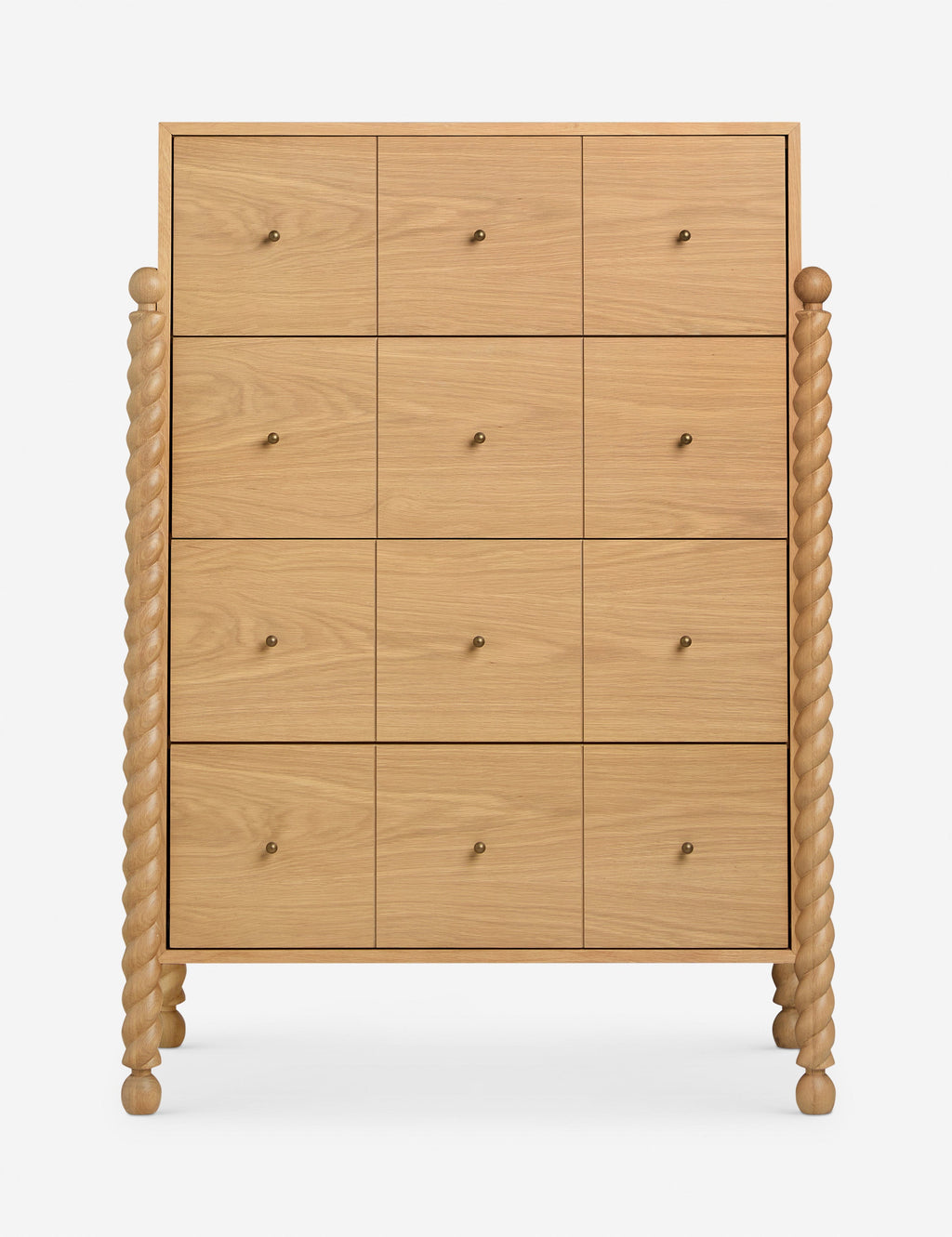 Commode haute - Mélange raffiné de formes et de lignes, cette commode présente des pieds sculptés tournés qui encadrent une structure aux lignes épurées