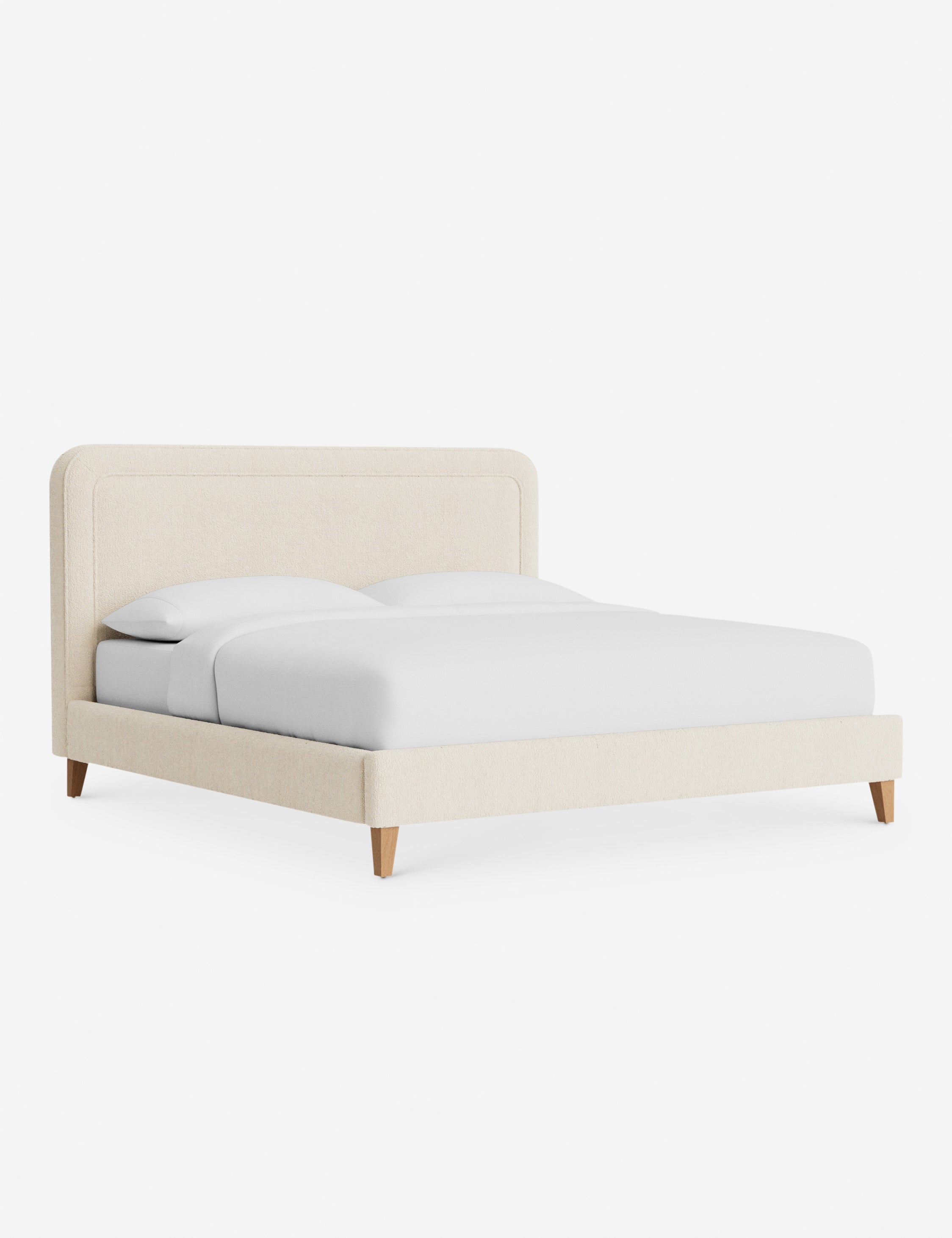 Lit - Avec ses lignes épurées et son cadre rembourré, le lit offre un look à la fois élégant et accueillant