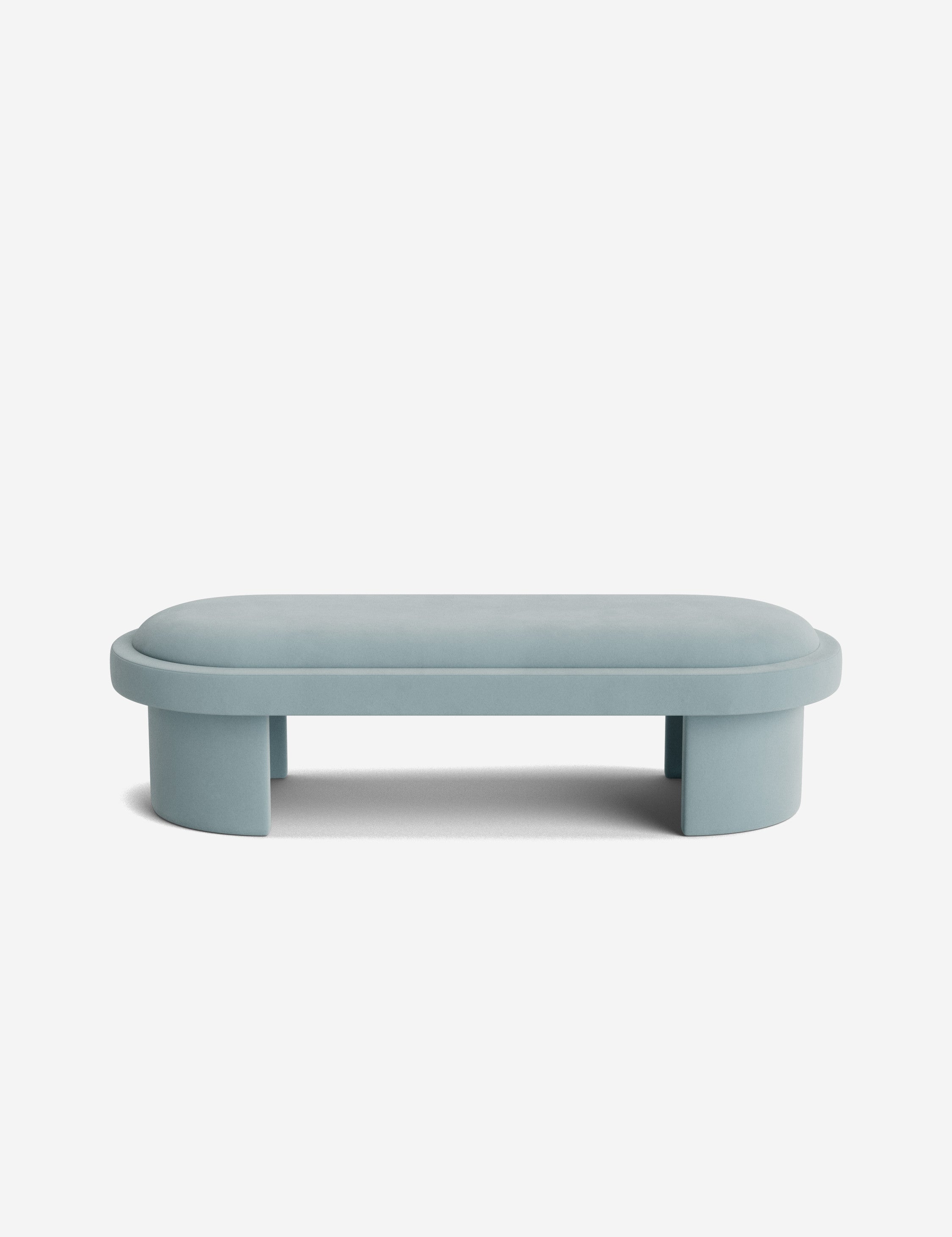 Banc - Une simplicité sculpturale définit le banc, dont l'assise capitonnée et les pieds incurvés offrent un moment d'architecture discrète