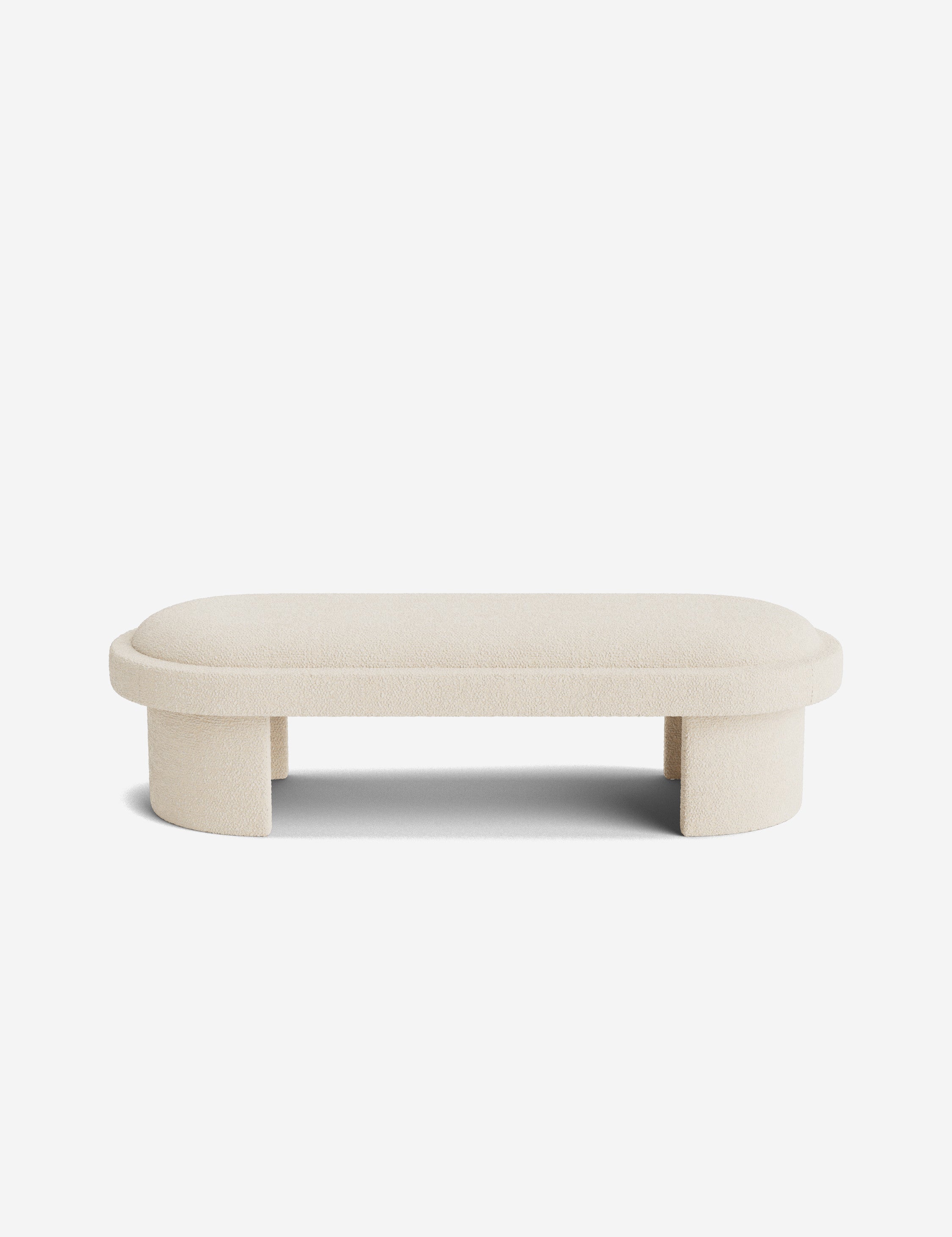 Banc - Une simplicité sculpturale définit le banc, dont l'assise capitonnée et les pieds incurvés offrent un moment d'architecture discrète